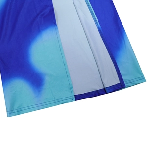 Close-up of the seam stitching and blue gradient fabric on a slim slit dress