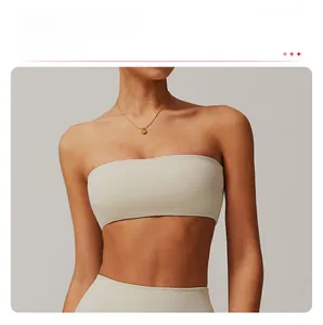 Close-up of seamless cream strapless bandeau bra with smooth, elastic fabric texture
