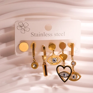 Detailed set of six gold stainless steel earrings with heart and eye motifs