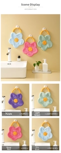 Detail of sunflower-shaped coral fleece hand towels showing hanging loops and soft textures