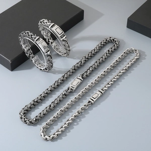 Retro stainless steel braided chain jewelry set featuring matching bracelets and necklaces