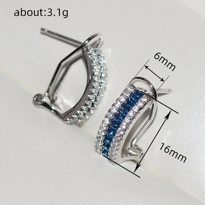 Elegant silver hoop earrings with blue square stones and sparkling clear crystals