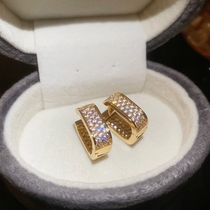 Sparkling gold rectangular hoop earrings with micro-paved zircons in a jewelry gift box
