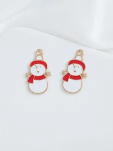 Detail of red and white enamel snowman charms with gold edges for DIY Christmas jewelry