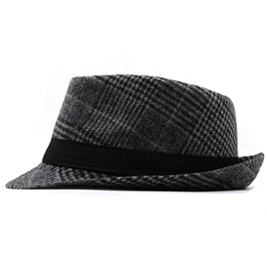 Detailed view of the wool jazz hat featuring a black and gray plaid pattern and ribbon