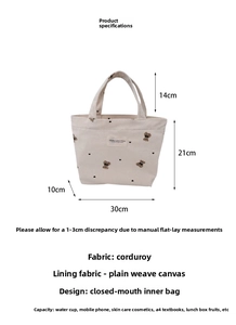 Detail view of corduroy tote bag showing embroidery with dimensions 30x21x10cm