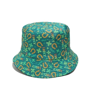 Detailed pattern of St. Patrick's Day green bucket hat with horseshoes and lucky text