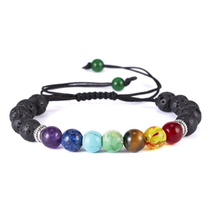 Macro shot of 7-chakra natural stone beads with adjustable black braided cord detail
