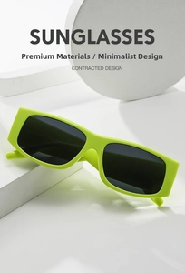 Detail view of fluorescent green rectangular sunglasses with wide temples on a prop