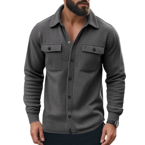 Close-up of charcoal grey flannel shirt jacket featuring dual chest pockets and buttons