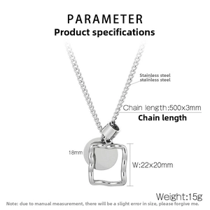 Macro view of stainless steel square frame and round disc pendant necklace