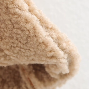 Sleeveless fleece vest jacket for women in beige featuring a cozy curly shearling texture