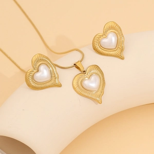 Elegant gold heart jewelry set with faux pearls including necklace and stud earrings