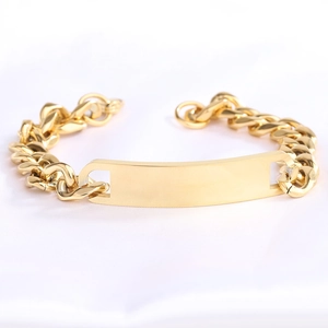 Macro shot of gold-plated 11mm Cuban chain bracelet with customizable blank bar