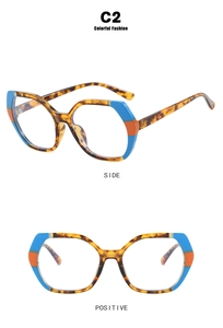 Detail view of blue and orange tortoiseshell TR90 polygon glasses frame side and front