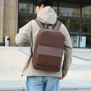 Business travel laptop backpack in dark brown faux leather with a minimalist large design
