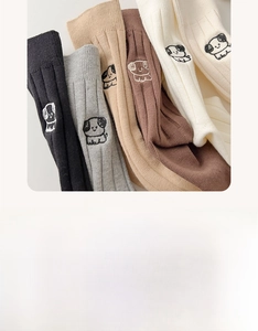 Detail of five pairs of cotton mid-calf socks with colorful puppy embroidery