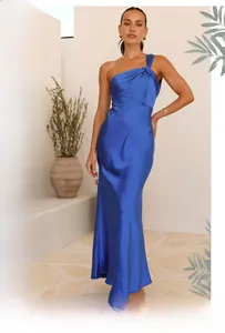 Detail showing the elegant royal blue satin fabric and one-shoulder neckline design