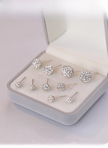 Macro view of S925 sterling silver Shamballa rhinestone stud earrings in multiple sizes