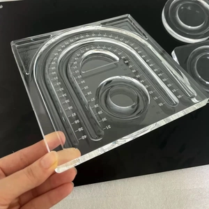 Macro view of clear acrylic jewelry measuring board with precise numbered scales