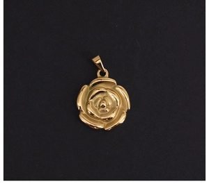 Close-up of 18K gold plated stainless steel rose flower pendant with textured petals