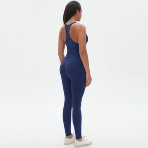 Deep blue seamless backless yoga jumpsuit showing professional athletic compression fit
