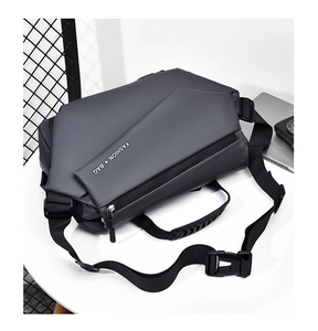 Detail of dark gray waterproof crossbody bag with FASHION BAG print on a white surface