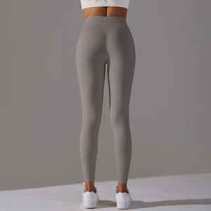 Rear view of high-waist grey yoga leggings showing seamless push-up effect and peach lift