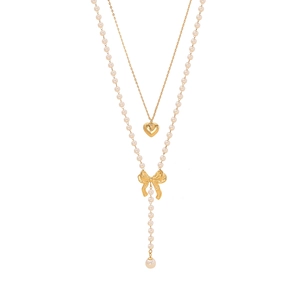 Double-layered gold necklace featuring pearl tassels, heart pendant and bow knot charm