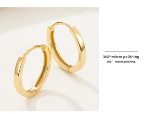 Detailed macro view showing the S925 hallmark and 360-degree mirror polish on gold earrings
