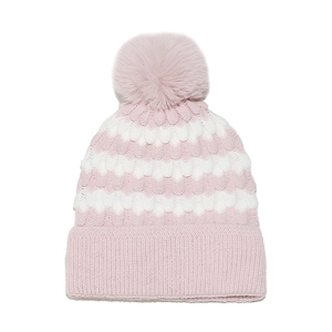 Detailed view of pink and white wave-pattern knit hat with fluffy faux fur pom-pom