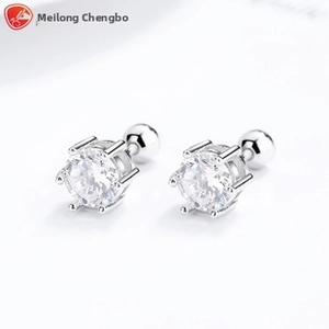 Detail of 925 sterling silver four-prong stud earrings with screw back safety balls