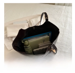 Interior view of the large brown tote bag showing capacity for iPad and daily essentials