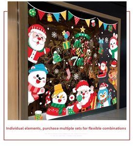 Detail of Christmas window stickers featuring Santa Claus and snowman on glass display