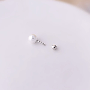 Detail view of 1.2mm titanium steel pearl stud with secure screw back closure