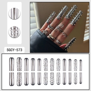 Cyberpunk metallic silver extra long press-on nails with 3D punk spikes and mirror finish