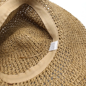 Straw sun hat made of 100% paper fiber featuring an adjustable sweatband and fine weave