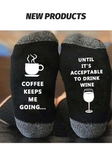 Close-up of funny text and wine cup print on black cotton socks soles with grey heels