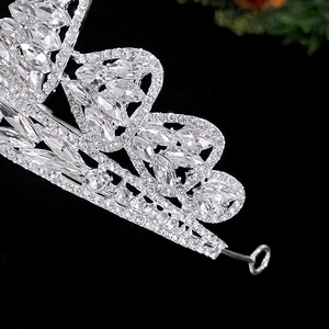 Macro shot of silver bridal tiara detail with sparkling zircon crystal leaf patterns