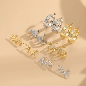 Chic gold and silver C-shaped claw earrings with cubic zirconia lightning design