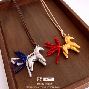 Minimalist horse pendant necklace with colorful handmade beaded tail on brown wax cord