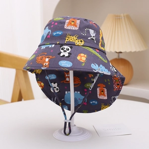 Detail of cartoon animal print kids sun hat with wide brim and adjustable windproof rope
