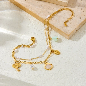 Layered gold stainless steel anklet with shell pearls elephant and leaf charms on stone