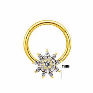 Detail of a 11mm gold septum clicker with marquise zircon stones in a sunburst design