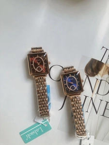 Detail view of luxury rose gold steel band watches with rhinestone bezels and color dials