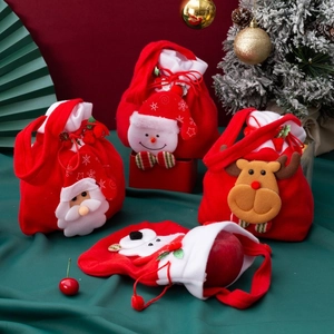 Detail of Christmas drawstring gift bags with cute 3D Santa, Snowman and Reindeer dolls