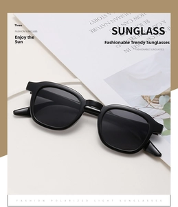 Detail view of vintage round polarized sunglasses with black frames and dark grey lenses