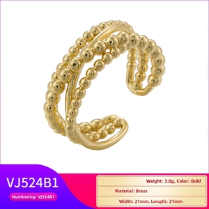 Detail showing the gold adjustable beaded ring made of premium textured brass