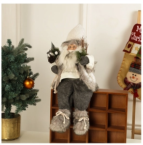 Detail of plush Santa Claus figure sitting on a wooden frame with festive home decor