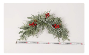 Detail showing artificial red berry wreath with eucalyptus leaves measuring 60cm length